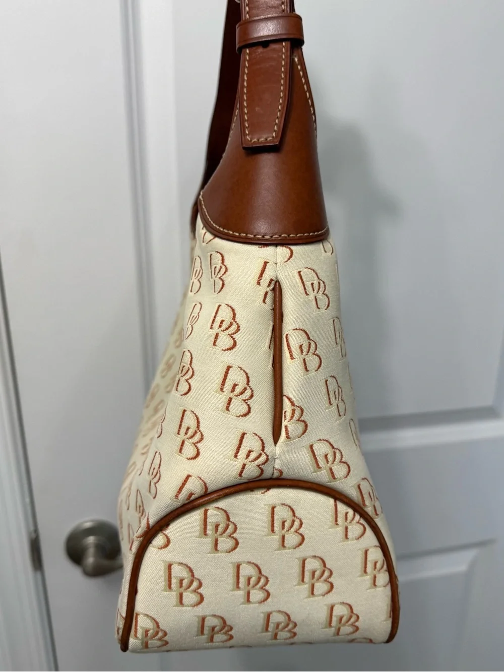 Dooney & Bourke Cream/Brown Signature Logo Lock Canvas Hobo Shoulder Bag
